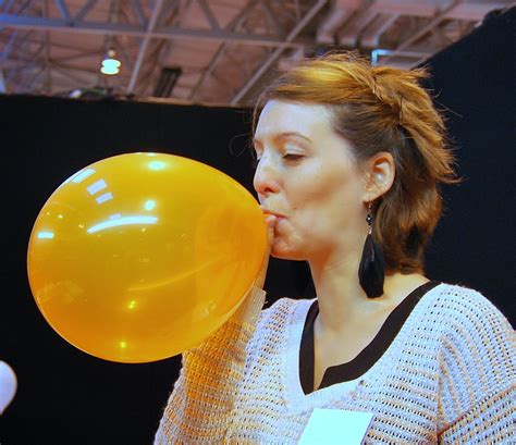 balloon blowing woman